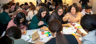 Attendees making Cartoneras at the Migration Museum